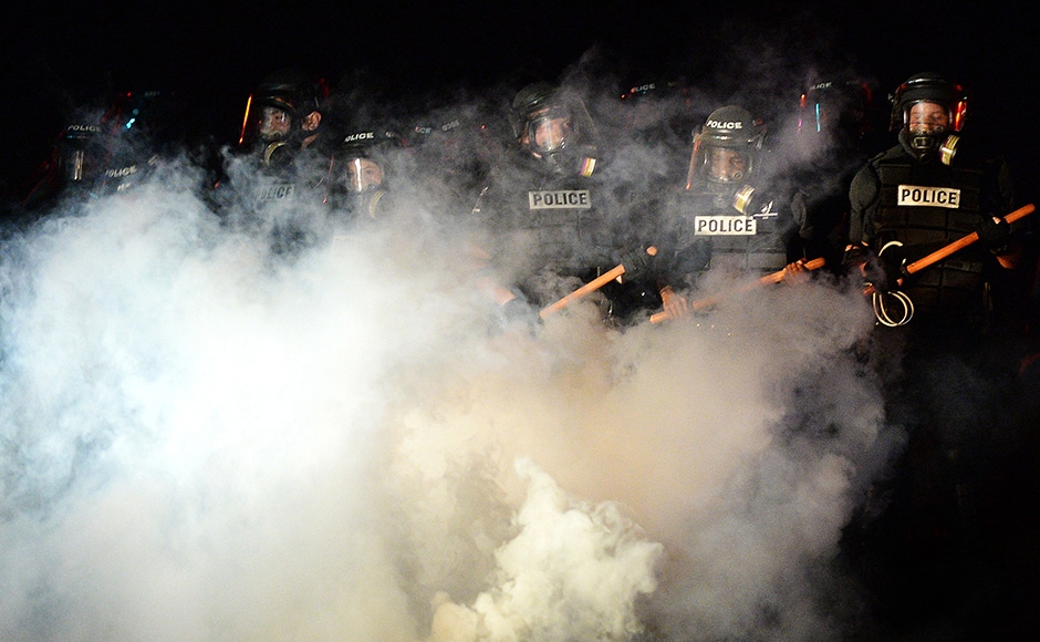 Police stand in formation in Charlotte. Authorities used tear gas to disperse protesters in an overnight demonstration that broke out Tuesday after Keith Lamont Scott was fatally shot by an officer at an apartment complex. AP Police stand in formation in Charlotte. Authorities used tear gas to disperse protesters in an overnight demonstration that broke out Tuesday after Keith Lamont Scott was fatally shot by an officer at an apartment complex. AP