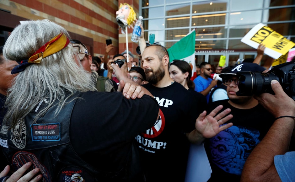 Trump asserted that Mexico would indeed pay for a border wall between Mexico and US. People in Arizona fought amongst themselves even as they all protested against Trump. Photo: Reuters Trump asserted that Mexico would indeed pay for a border wall between Mexico and US. People in Arizona fought amongst themselves even as they all protested against Trump. Photo: Reuters