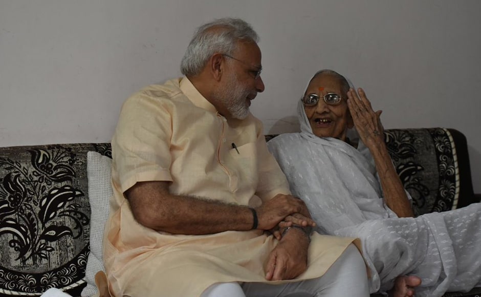 PM Modi interacts with his mother on his birthday in Gandhinagar. Modi celebrated his 66th birthday with his mother Hiraba, tribals and specially-challenged people in Gujarat. PTI PM Modi interacts with his mother on his birthday in Gandhinagar. Modi celebrated his 66th birthday with his mother Hiraba, tribals and specially-challenged people in Gujarat. PTI