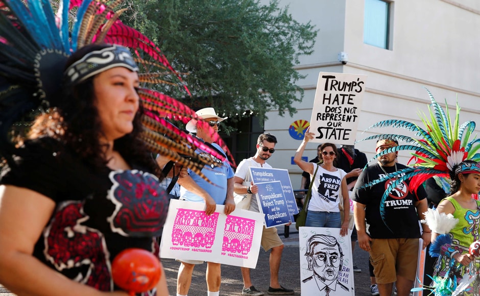 Donald Trump's back-to-back immigration-focused events in Mexico and Arizona were an astounding display of political whiplash. Women performed an Aztec dance even as protesters rallied against Trump's visit. Photo: Reuters Donald Trump's back-to-back immigration-focused events in Mexico and Arizona were an astounding display of political whiplash. Women performed an Aztec dance even as protesters rallied against Trump's visit. Photo: Reuters