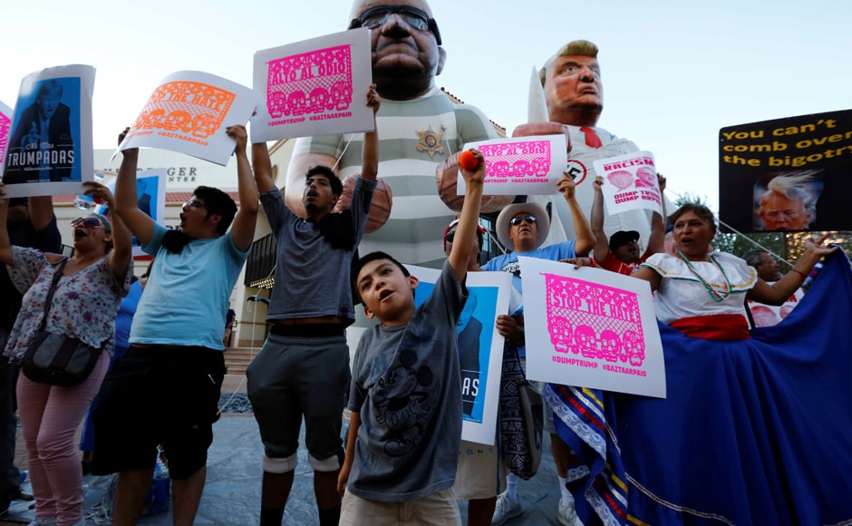 In phoenix, Trump called many illegal migrants 'murderers. Protesters rallied against Trump's visit. Photo: Reuters In phoenix, Trump called many illegal migrants 'murderers. Protesters rallied against Trump's visit. Photo: Reuters