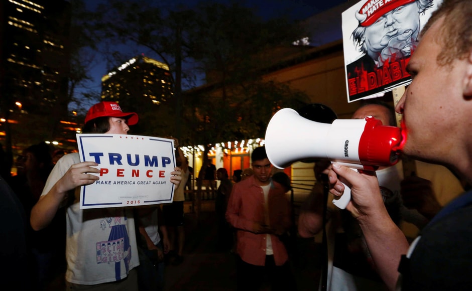 Protesters rallying against Trump's stance on immigrants and his trip to Mexico had a face off with his supporters outside the Phoenix Convention Center Phoenix, Arizona. Photo: Reuters Protesters rallying against Trump's stance on immigrants and his trip to Mexico had a face off with his supporters outside the Phoenix Convention Center Phoenix, Arizona. Photo: Reuters