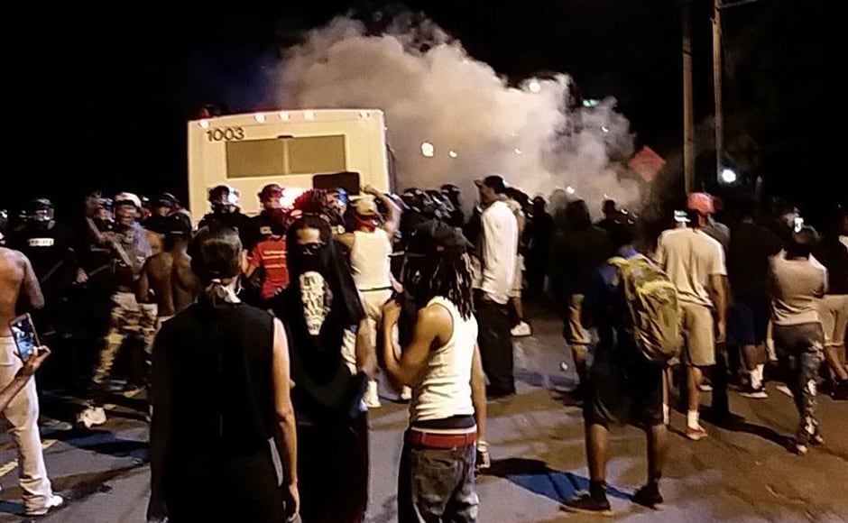 Police fire tear gas into the crowd of protesters on Old Concord Road late Tuesday night in Charlotte. AP Police fire tear gas into the crowd of protesters on Old Concord Road late Tuesday night in Charlotte. AP