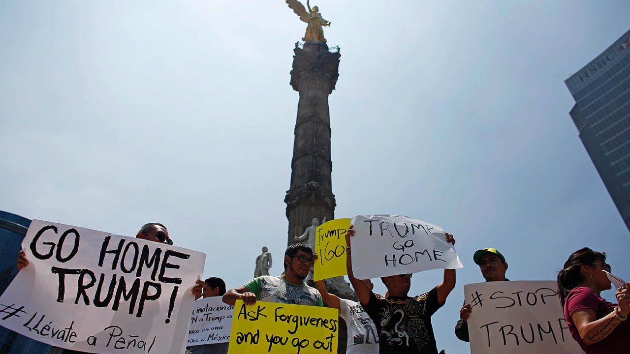 Donald Trump issued a stern anti-immigration warning after visiting Mexico, saying people who cross into the United States illegally would never obtain legal status. Mexican people were hurt by his comments. Several people protested against his visit at the Angel of Independence monument. Photo: Reuters Donald Trump issued a stern anti-immigration warning after visiting Mexico, saying people who cross into the United States illegally would never obtain legal status. Mexican people were hurt by his comments. Several people protested against his visit at the Angel of Independence monument. Photo: Reuters