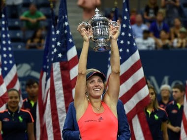 Angelique Kerber holds up the US Open trophy after defeating Karolina Pliskova. AFP