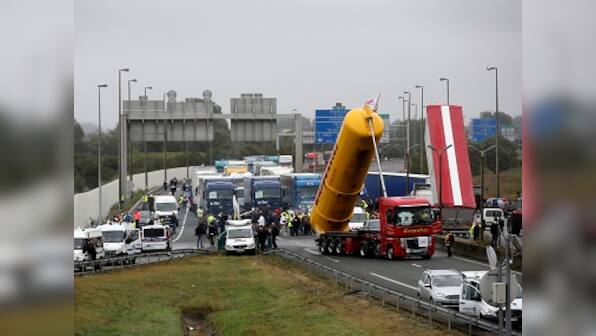 Britain to start building 13 ft wall in French port of Calais to keep out migrants