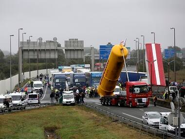 Britain to start building 13 ft wall in French port of Calais to keep out migrants