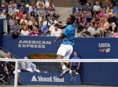 Gael Monfils returns the ball against Lucas Pouille during their US Open quarter-final. AFP