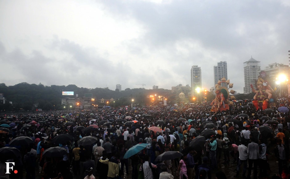 Clouds gathered on the morning of the final day of Visarjan. Various people gathered on the beachs of Mumbai with umbrellas in hand to say their farewell to Lord Ganesha. Sachin Gokhale/Firstpost Clouds gathered on the morning of the final day of Visarjan. Various people gathered on the beachs of Mumbai with umbrellas in hand to say their farewell to Lord Ganesha. Sachin Gokhale/Firstpost