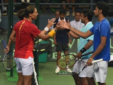 Spain's Rafael Nadal and Marc Lopez with India's Leander Paes and Saketh Myeni after wining the Davis Cup match. AP