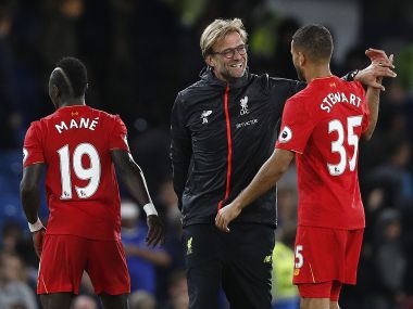 Liverpool manager Jurgen Klopp celebrates with his players after his side's 2-1 win over Chelsea in the Premier League. AFP