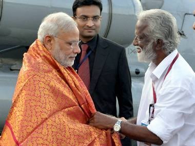Prime Minister Narendra Modi being received by Kerala-BJP President Kummanam Rajashegaran at airport in Kozhikode on Saturday. PTI