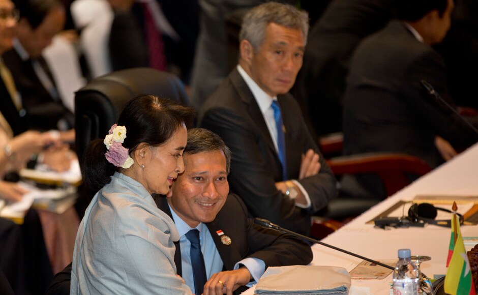 Myanmar's Foreign Minister Aung San Suu Kyi, left, smilies as she speaks with Singapore's Foreign Minister Vivian Balakrishnan, center, ahead of 19th ASEAN-China summit, a parallel summit in the ongoing ASEAN Summits and other related summits at National Convention Center in Vientiane. AP Myanmar's Foreign Minister Aung San Suu Kyi, left, smilies as she speaks with Singapore's Foreign Minister Vivian Balakrishnan, center, ahead of 19th ASEAN-China summit, a parallel summit in the ongoing ASEAN Summits and other related summits at National Convention Center in Vientiane. AP