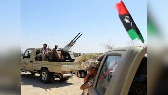 Libya clashes: At least 20 dead, 60 injured as violence shuts Tripoli airport; govt says assault was aimed at freeing terrorists