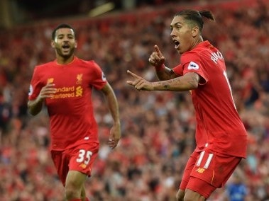 Liverpool's Roberto Firmino celebrates after scoring their fourth goal. AFP