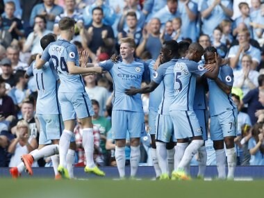 Manchester City's Ilkay Gundogan celebrates scoring their fourth goal with teammates. Reuters
