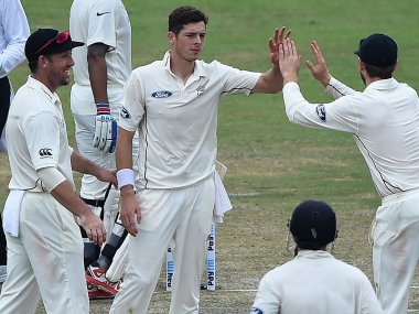 New Zealand's Mitchell Santner celebrates with his teammates on Day 1 of the Test against India. AFP