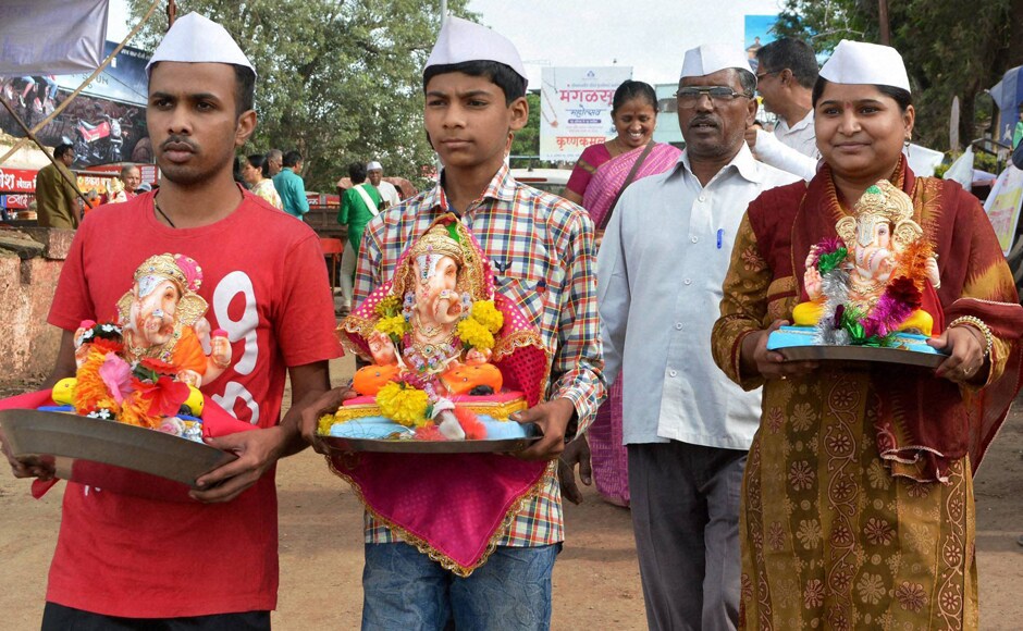 Devotees carry Ganesh idols for immersion in Karad, Maharashtra on Saturday. (Photo courtesy: PTI) Devotees carry Ganesh idols for immersion in Karad, Maharashtra on Saturday. (Photo courtesy: PTI)