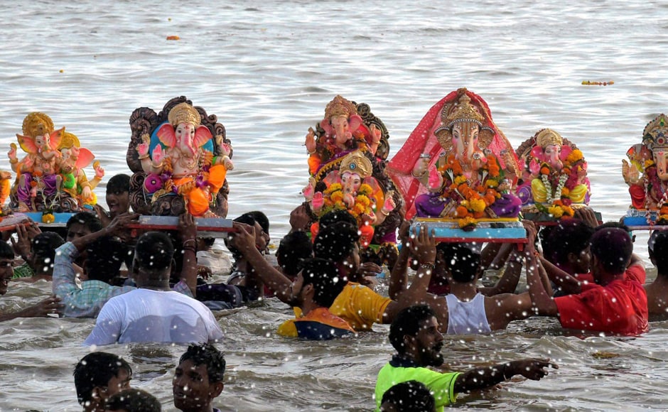 Lord Ganesha, the son of Lord Shiva and Parvati, is widely worshipped as the god of wisdom, prosperity and good fortune and traditionally invoked at the beginning of any new venture. Devotees carry Ganesh idols for immersion in the Arabian sea on Saturday. (Photo courtesy: PTI) Lord Ganesha, the son of Lord Shiva and Parvati, is widely worshipped as the god of wisdom, prosperity and good fortune and traditionally invoked at the beginning of any new venture. Devotees carry Ganesh idols for immersion in the Arabian sea on Saturday. (Photo courtesy: PTI)