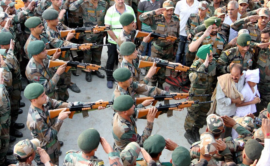 Army jawans paying gun salute during the funeral of Havildar Ravi Paul at his native village, Sarwa in Samba on Monday. Ravi Paul was martyred in terrorist attack at the Army Camp at Uri near LoC. PTI Army jawans paying gun salute during the funeral of Havildar Ravi Paul at his native village, Sarwa in Samba on Monday. Ravi Paul was martyred in terrorist attack at the Army Camp at Uri near LoC. PTI