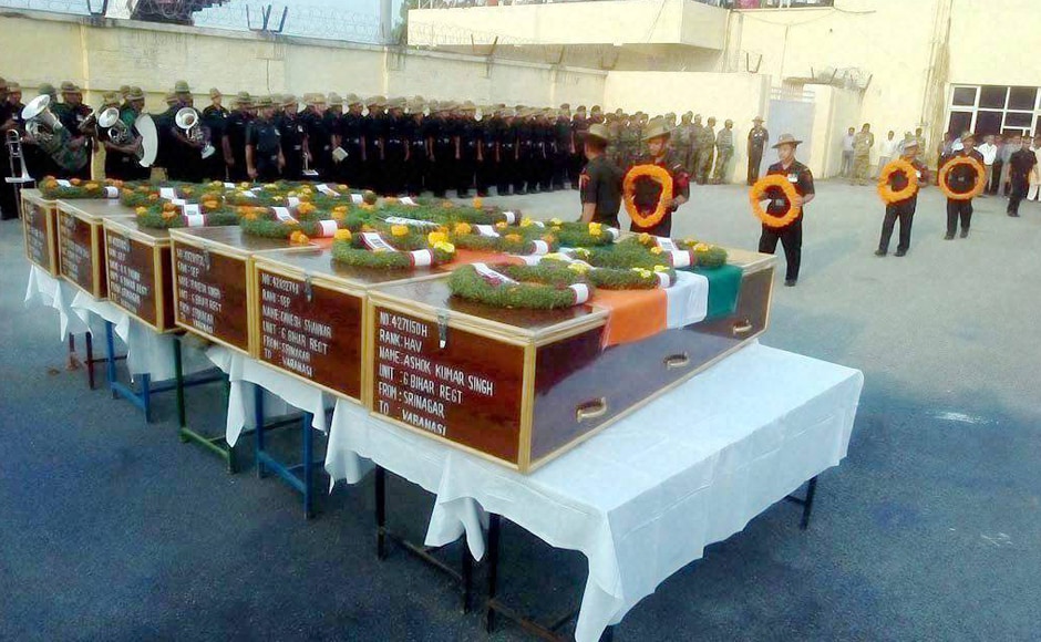 Army officers pay homage to seven army soldiers who were killed in the Uri attack, at Babatpur Airport in Varanasi on Monday. PTI Army officers pay homage to seven army soldiers who were killed in the Uri attack, at Babatpur Airport in Varanasi on Monday. PTI