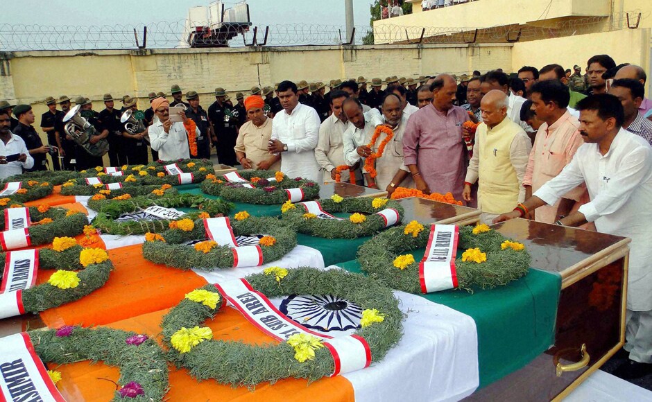 People pay homage to seven army soldiers who were killed in the Uri attack, at Babatpur Airport in Varanasi on Monday. PTI People pay homage to seven army soldiers who were killed in the Uri attack, at Babatpur Airport in Varanasi on Monday. PTI