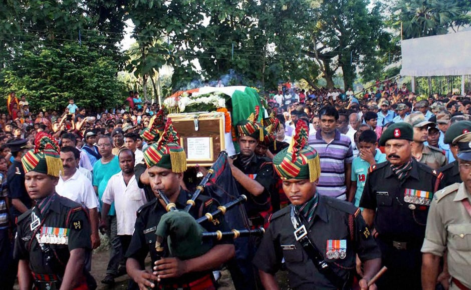 Army jawans carry the coffin of Sepoy Gangadhar Dolui, who was martyred in Uri attack, in Howrah on Tuesday. PTI Army jawans carry the coffin of Sepoy Gangadhar Dolui, who was martyred in Uri attack, in Howrah on Tuesday. PTI
