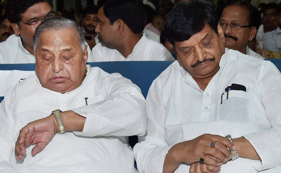 Prajapati’s re-induction on the cards is a part of a compromise formula to douse the flames in the Yadav clan that took the hue of a major political crisis recently where Mulayam Singh Yadav (left) removed his son, Akhilesh Yadav as state party chief and then the Chief Minister stripped his uncle Shivpal Yadav (right) of four key portfolios. Both were present at the oath-taking ceremony. (Photos: PTI) Prajapati’s re-induction on the cards is a part of a compromise formula to douse the flames in the Yadav clan that took the hue of a major political crisis recently where Mulayam Singh Yadav (left) removed his son, Akhilesh Yadav as state party chief and then the Chief Minister stripped his uncle Shivpal Yadav (right) of four key portfolios. Both were present at the oath-taking ceremony. (Photos: PTI)
