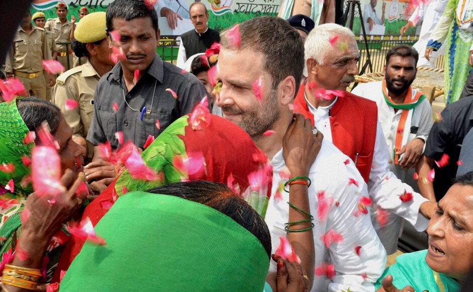 Gandhi was welcomed by locals before his 'Khat pe Charcha' programme began. He said he had joined the farmers' protest against land acquisition at the event. Photo: PTI Gandhi was welcomed by locals before his 'Khat pe Charcha' programme began. He said he had joined the farmers' protest against land acquisition at the event. Photo: PTI