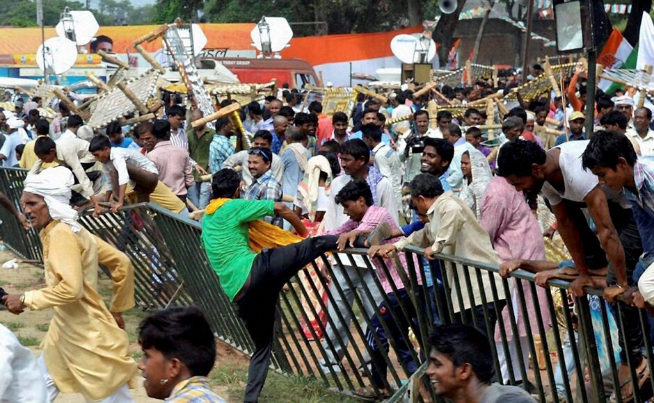Soon after Gandhi's rally was over, the farmers were seen fighting amongst themselves for cots that were laid for the audience. A scene of chaos ensued soon after. Photo: PTI Soon after Gandhi's rally was over, the farmers were seen fighting amongst themselves for cots that were laid for the audience. A scene of chaos ensued soon after. Photo: PTI