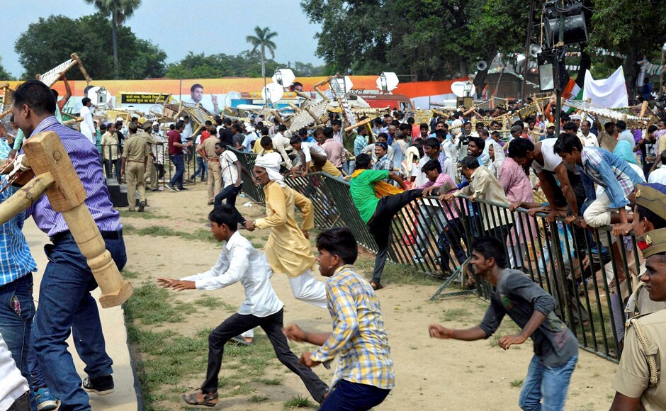 Within minutes of Gandhi leaving the venue, onlookers swooped in and made away with the cots. Photo: PTI Within minutes of Gandhi leaving the venue, onlookers swooped in and made away with the cots. Photo: PTI