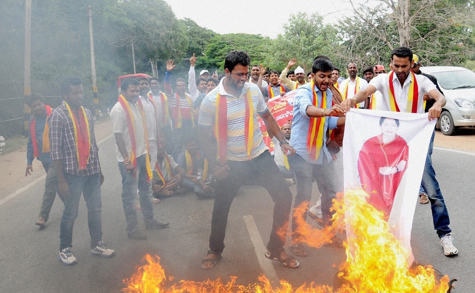 Protesters held road blockades and dharnas at several places. Activists also burnt posters of Tamil Nadu CM J Jayalalithaa during the agitation. Photo: PTI Protesters held road blockades and dharnas at several places. Activists also burnt posters of Tamil Nadu CM J Jayalalithaa during the agitation. Photo: PTI