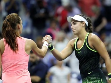 Ana Konjuh shakes hands with Agnieszka Radwanska. Reuters
