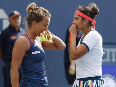 Sania Mirza talks with doubles partner Barbora Strycova at the US Open. AP