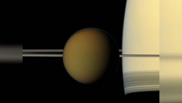 Nasa's Cassini spacecraft spots 'impossible' cloud on Saturn's largest moon Titan