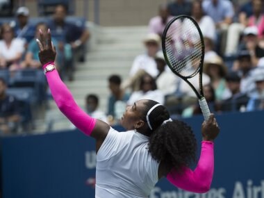 Serena Williams serves to Johanna Larsson at the US Open. AFP