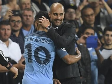 Manchester City's Spanish manager Pep Guardiola with Sergio Aguero. AFP