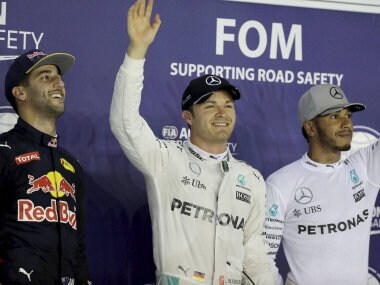 Nico Rosberg waves after taking pole position during the qualifying session for the Singapore GP. AP