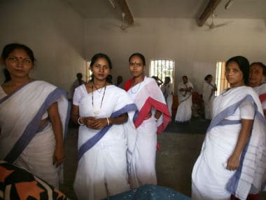 Women inmates watch visitors from their cell in a prison in Kolkata. Reuters