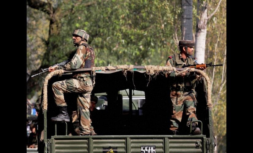 Soldiers guard outside the army base in Uri. PTI