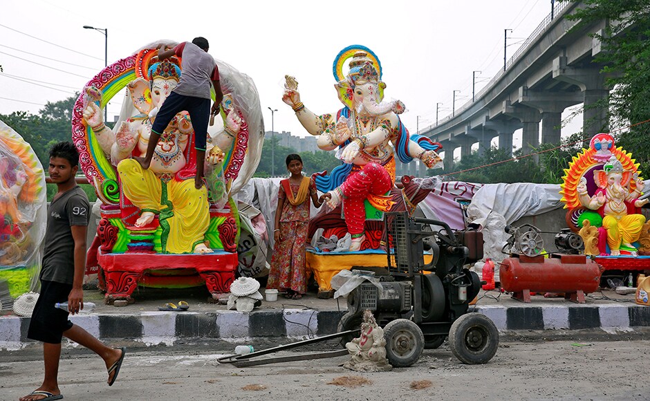 Workers transport an idol of Hindu god Ganesh, the deity of prosperity, on a cart ahead of the Ganesh Chaturthi festival, in Bengaluru. Reuters Workers transport an idol of Hindu god Ganesh, the deity of prosperity, on a cart ahead of the Ganesh Chaturthi festival, in Bengaluru. Reuters