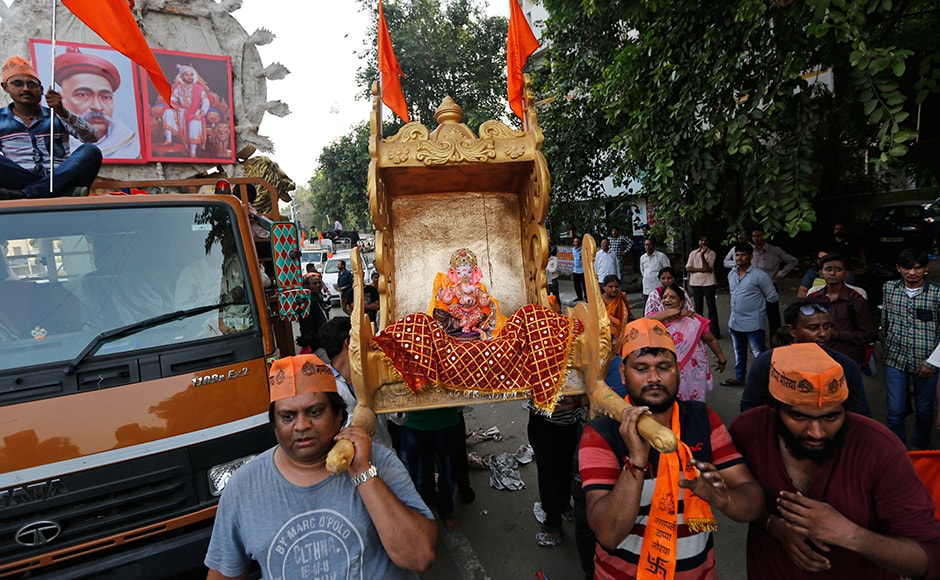 People carry an idol of Ganesha ahead of Ganesh Chaturthi festival in Ahmedabad. AP People carry an idol of Ganesha ahead of Ganesh Chaturthi festival in Ahmedabad. AP