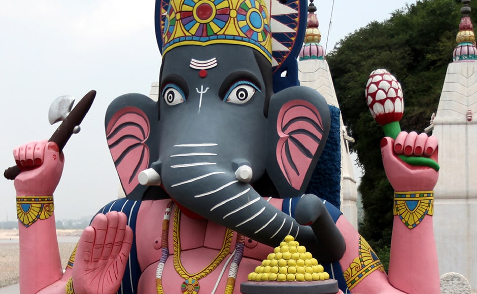 An Indian devotee cleans an giant idol of the Hindu God Ganesh at a temple in Jammu. AFP An Indian devotee cleans an giant idol of the Hindu God Ganesh at a temple in Jammu. AFP