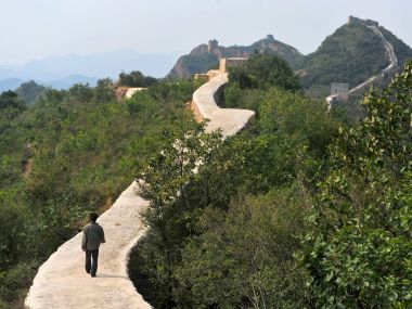 Chinese officials are being pilloried over the smoothing-over of a crumbling but much-loved 700-year-old section of the Great Wall of China - a UNESCO World Heritage Site - in the name of restoration. AP