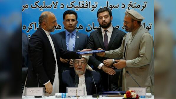 Afghan warlord Gulbuddin Hekmatyar signs peace pact with President