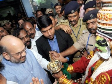 BJP president Amit Shah was given a traditional welcome on his arrival at the airport in Kozhikode on Thursday for National Council Meet. PTI