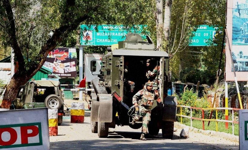 Army soldiers rush to the attack site in Uri. PTI