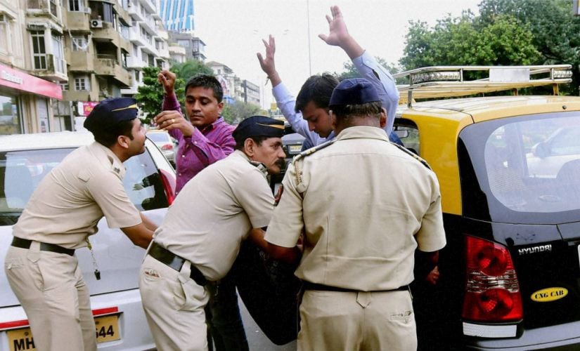 Mumbai police check passengers at a checkpost after a high alert was issued. PTI