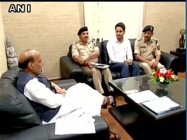 Union Home Minister Rajnath Singh meets Nabeel Ahmad Wani who topped BSF exam. Image courtesy: @ANI_news