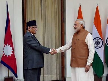 Prime Minister Narendra Modi greets Nepalese counterpart Pushpa Kamal Dahal at Hyderabad house in New Delhi on Friday. PTI